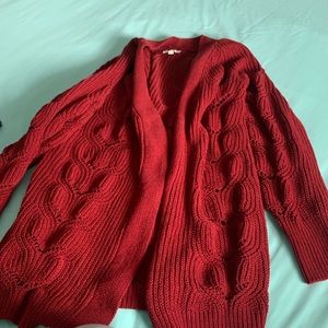 Red cable knit sweater.
